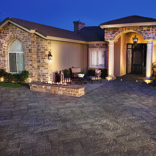 Photo of Townscape Driveway at Southwestern home with rough stone facade