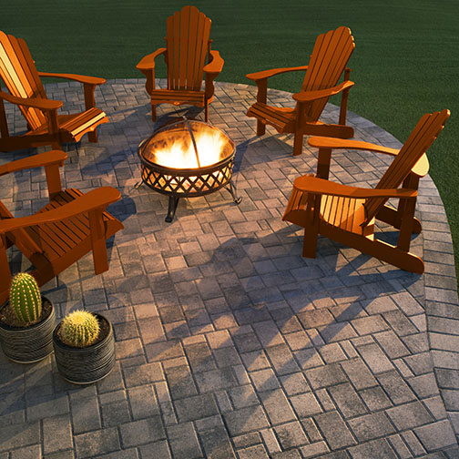 A slate toned Townscape Paver patio with a lit metal mesh firepit surrounded by five indian-red adirondack chairs Patio